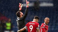 WEST BROMWICH, ENGLAND - MAY 16: Alisson of Liverpool celebrates with team mate Roberto Firmino after scoring their side&#039;s second goal during the Premier League match between West Bromwich Albion and Liverpool at The Hawthorns on May 16, 2021 in West