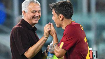 AS Roma's Argentinian forward Paulo Dybala (R) jokes with AS Roma's Portuguese coach Jose Mourinho as he is being substituted during the Italian Serie A football match between AS Roma and Monza on August 30, 2022 at the Olympic stadium in Rome. (Photo by Alberto PIZZOLI / AFP) (Photo by ALBERTO PIZZOLI/AFP via Getty Images)