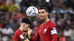 Portugal's forward #07 Cristiano Ronaldo eyes the ball during the Qatar 2022 World Cup round of 16 football match between Portugal and Switzerland at Lusail Stadium in Lusail, north of Doha on December 6, 2022. (Photo by Fabrice COFFRINI / AFP)