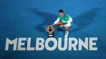 Serbian tennis player Novak Djokovic poses with the 2021 Australian Open champion trophy.