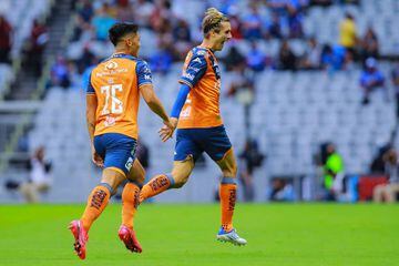MEXICO CITY, MEXICO - JULY 23: Jordi Cortizo (R) of Puebla celebrates after scoring his team's first goal during the 4th round match between Cruz Azul and Puebla as part of the Torneo Apertura 2022 Liga MX at Azteca Stadium on July 23, 2022 in Mexico City, Mexico. (Photo by Manuel Velasquez/Getty Images)