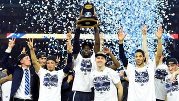 Apr 4, 2016; Houston, TX, USA; Villanova Wildcats forward Daniel Ochefu hoists the national championship trophy with teammates after defeating the North Carolina Tar Heels in the championship game of the 2016 NCAA Men&#039;s Final Four at NRG Stadium. 