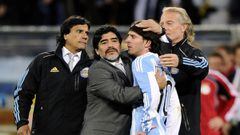 Argentina&#039;s coach Diego Maradona hugs Lionel Messi after Germany won their 2010 World Cup quarter-final soccer match at Green Point stadium in Cape Town July 3, 2010.    REUTERS/Dylan Martinez (SOUTH AFRICA  - Tags: SPORT SOCCER WORLD CUP) MUNDIAL S