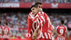 Atletico Madrid's Spanish midfielder Alvaro Morata (back) celebrates with teammate after scoring his team's second goal  during the Spanish League football match between Sevilla FC and Club Atletico de Madrid at the Ramon Sanchez Pizjuan stadium in Seville on October 1, 2022. (Photo by CRISTINA QUICLER / AFP) (Photo by CRISTINA QUICLER/AFP via Getty Images)