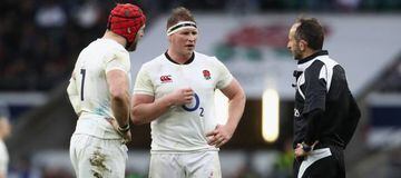 Dylan Hartley (C) the England captain talks to referee Romain Poite (R) as team mate James Haskell looks on.