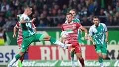 dpatop - 09 September 2022, Bremen: Soccer: Bundesliga, Werder Bremen - FC Augsburg, Matchday 6, wohninvest Weserstadion. Werder's Marco Friedl (l) fights Augsburg's Ermedin Demirovic for the ball. Photo: Carmen Jaspersen/dpa - IMPORTANT NOTE: In accordance with the requirements of the DFL Deutsche Fußball Liga and the DFB Deutscher Fußball-Bund, it is prohibited to use or have used photographs taken in the stadium and/or of the match in the form of sequence pictures and/or video-like photo series. (Photo by Carmen Jaspersen/picture alliance via Getty Images)
