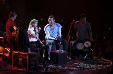 Shakira and Chris Martin from Coldplay perform together on stage during the Global Citizen Festival G20 benefit concert at the Barclaycard Arena in Hamburg, northern Germany on the eve of the G20 summit.
