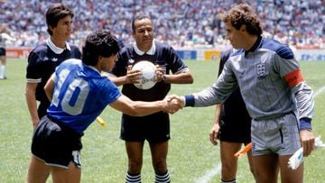 Argentina captain Diego Maradona (l) shakes hands with England captain Peter Shilton (r) as referee Ali Bennaceur (c) checks the match ball is fully inflated and linesman Morera Berny Ulloa (far l) looks on  (Photo by Peter Robinson/EMPICS via Getty Image