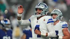 EAST RUTHERFORD, NEW JERSEY - SEPTEMBER 10: Dak Prescott #4 of the Dallas Cowboys reacts after a touchdown run by KaVontae Turpin #9 during the fourth quarter against the New York Giants at MetLife Stadium on September 10, 2023 in East Rutherford, New Jersey.   Mitchell Leff/Getty Images/AFP (Photo by Mitchell Leff / GETTY IMAGES NORTH AMERICA / Getty Images via AFP)