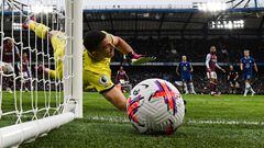 Aston Villa's Argentinian goalkeeper Emiliano Martinez jumps for the ball during the English Premier League football match between Chelsea and Aston Villa at Stamford Bridge in London on April 1, 2023. (Photo by JUSTIN TALLIS / AFP) / RESTRICTED TO EDITORIAL USE. No use with unauthorized audio, video, data, fixture lists, club/league logos or 'live' services. Online in-match use limited to 120 images. An additional 40 images may be used in extra time. No video emulation. Social media in-match use limited to 120 images. An additional 40 images may be used in extra time. No use in betting publications, games or single club/league/player publications. / 