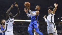 Oct 31, 2017; Milwaukee, WI, USA; Oklahoma City Thunder guard Russell Westbrook (0) takes a shot between Milwaukee Bucks center Thon Maker (7) and forward D.J. Wilson (5) in the second quarter at BMO Harris Bradley Center. Mandatory Credit: Benny Sieu-USA TODAY Sports