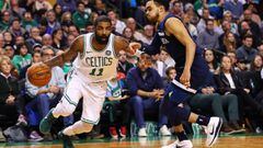 BOSTON, MA - JANUARY 4: Kyrie Irving #11 of the Boston Celtics drives against Tyus Jones #1 of the Minnesota Timberwolves during the second half at TD Garden on January 5, 2018 in Boston, Massachusetts. The Celtics defeat the Timberwolves 91-84.   Maddie 