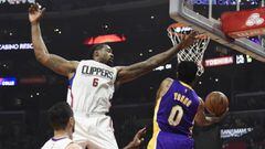 Jan 14, 2017; Los Angeles, CA, USA; Los Angeles Lakers guard Nick Young (0) shoots against LA Clippers center DeAndre Jordan (6) in the first half during the NBA game at the Staples Center. Mandatory Credit: Richard Mackson-USA TODAY Sports