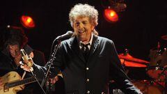 FILE - In this Jan. 12, 2012, file photo, Bob Dylan performs in Los Angeles. Dylan, who was named the winner of the 2016 Nobel Prize in literature on Oct. 13, 2016, says he “absolutely” wants to attend the Nobel Prize Award Ceremony “if it’s at all possible” in December, finally breaking his silence about earning the prestigious honor. (AP Photo/Chris Pizzello, File)