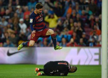 Messi leaps over Ivan Cuellar, who smothers the ball