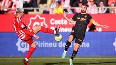 GIRONA, SPAIN - FEBRUARY 05: Valery Fernandez of Girona FC battles for possession with Jose Luis Gaya of Valencia CF during the LaLiga Santander match between Girona FC and Valencia CF at Montilivi Stadium on February 05, 2023 in Girona, Spain. (Photo by Eric Alonso/Getty Images)