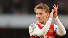 Arsenal's Norwegian midfielder Martin Odegaard celebrates at the end of the English Premier League football match between Arsenal and Bournemouth at the Emirates Stadium in London on March 4, 2023. - Arsenal won 3 - 2 against Bournemouth. (Photo by Glyn KIRK / AFP) / RESTRICTED TO EDITORIAL USE. No use with unauthorized audio, video, data, fixture lists, club/league logos or 'live' services. Online in-match use limited to 120 images. An additional 40 images may be used in extra time. No video emulation. Social media in-match use limited to 120 images. An additional 40 images may be used in extra time. No use in betting publications, games or single club/league/player publications. / 