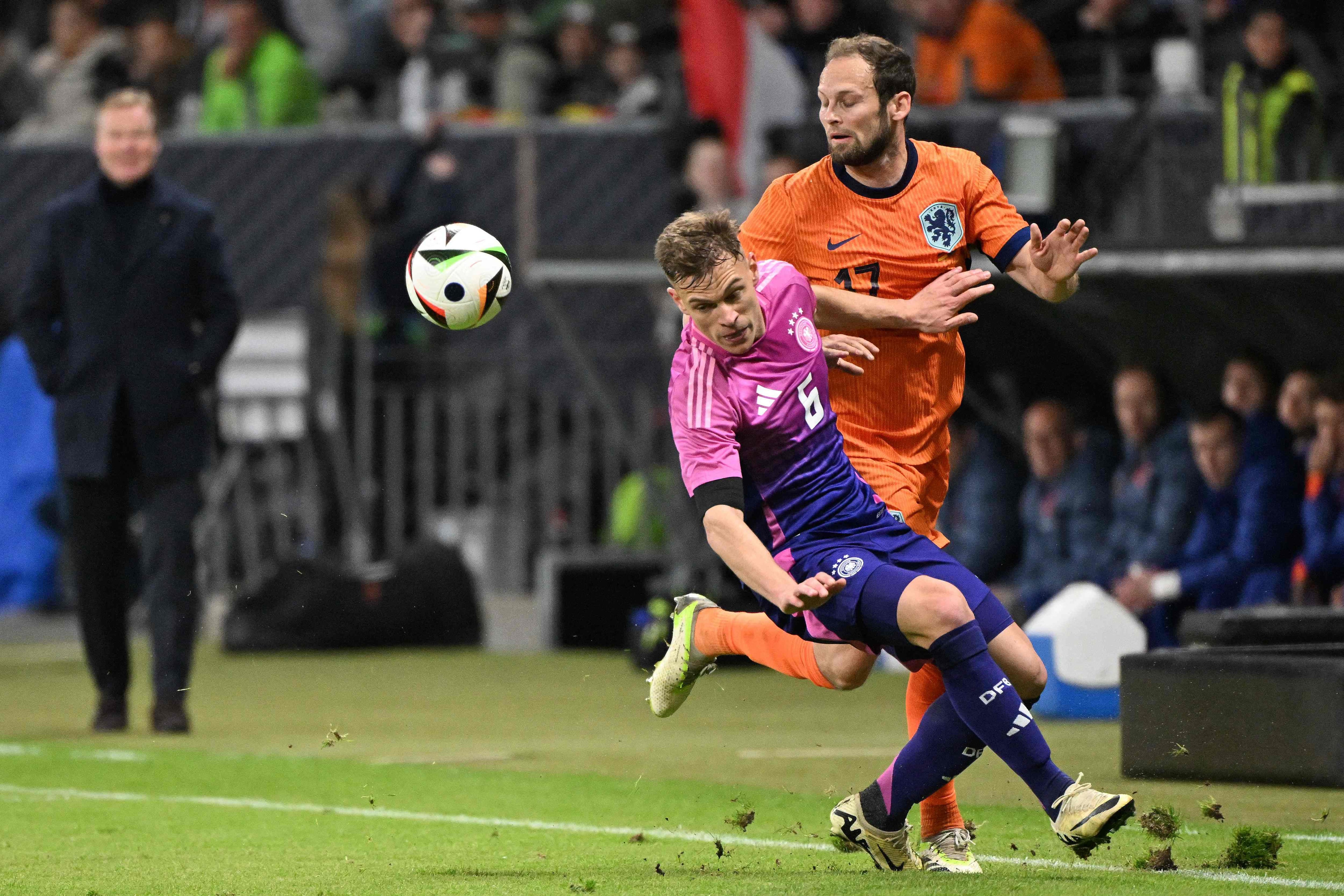 Netherlands' defender #17 Daley Blind (R) and Germany's midfielder #06 Joshua Kimmich vie for the ball during the friendly football match between Germany and Netherlands in Frankfurt, western Germany, on March 26, 2024. (Photo by Kirill KUDRYAVTSEV / AFP)