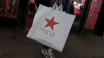FILE PHOTO: A customer exits the Macy's flagship department store in midtown Manhattan in New York City, November 11, 2015.  REUTERS/Brendan McDermid/File Photo