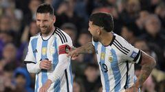 Argentina's forward Lionel Messi (L) receives the captain's armband from Argentina's defender Nicolas Otamendi upon stepping onto the field during the second half of the 2026 FIFA World Cup South American qualification football match between Argentina and Paraguay at the Mas Monumental stadium in Buenos Aires, on October 12, 2023. (Photo by JUAN MABROMATA / AFP)