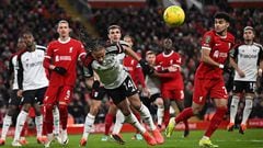 Fulham's Jamaican striker #14 Bobby Decordova-Reid headers the ball clear during the English League Cup semi-final first leg football match between Liverpool and Fulham at Anfield in Liverpool, north west England on January 10, 2024. (Photo by Paul ELLIS / AFP) / RESTRICTED TO EDITORIAL USE. No use with unauthorized audio, video, data, fixture lists, club/league logos or 'live' services. Online in-match use limited to 120 images. An additional 40 images may be used in extra time. No video emulation. Social media in-match use limited to 120 images. An additional 40 images may be used in extra time. No use in betting publications, games or single club/league/player publications. / 