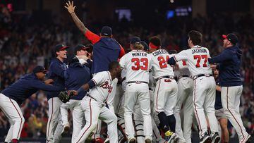 ATLANTA, GEORGIA - OCTOBER 23: Members of the Atlanta Braves celebrate after defeating the Los Angeles Dodgers in Game Six of the National League Championship Series at Truist Park on October 23, 2021 in Atlanta, Georgia. The Braves defeated the Dodgers 4