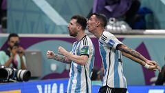 Argentina's forward #10 Lionel Messi celebrates scoring the opening goal with his teammate Argentina's midfielder #11 Angel Di Maria during the Qatar 2022 World Cup Group C football match between Argentina and Mexico at the Lusail Stadium in Lusail, north of Doha on November 26, 2022. (Photo by JUAN MABROMATA / AFP)