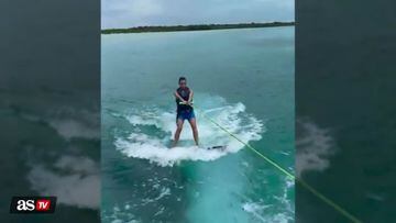 Kim Kardashian wipes out wakeboarding, but saves tequila bottle