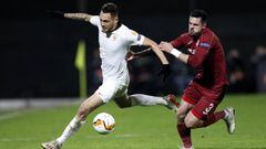 Cluj-napoca (Romania), 20/02/2020.- Sevilla&#039;s Lucas Ocampos (L) vies for the ball with CFR&#039;s Andrei Burca (R) during the UEFA Europa League round of 32, first leg soccer match CFR Cluj vs Sevilla FC, in Cluj Napoca, Romania, 20 February 2020. (R