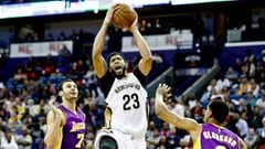 Nov 29, 2016; New Orleans, LA, USA; New Orleans Pelicans forward Anthony Davis (23) drives between Los Angeles Lakers forward Larry Nance Jr. (7) and guard Jordan Clarkson (6) during the second half of a game at the Smoothie King Center. The Pelicans defeated the Lakers 105-88. Mandatory Credit: Derick E. Hingle-USA TODAY Sports