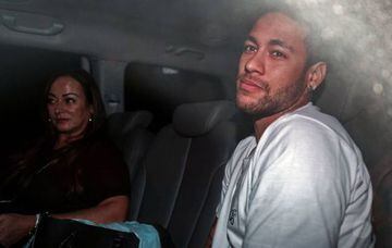 Brazilian superstar Neymar (R), is pictured next to his mother Nadine Goncalves Da Silva upon their arrival in Belo Horizonte, Minas Gerais state, Brazil on March 2, 2018 ahead of an operation on his fractured foot.