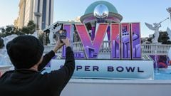 LAS VEGAS, NEVADA - FEBRUARY 03: A visitor records images of a Super Bowl LVIII logo and an oversized replica of the Vince Lombardi Trophy on the Las Vegas Strip in front of Caesars Palace February 03, 2024 in Las Vegas, Nevada. The game will be played on February 11, 2024, between the San Francisco 49ers and the Kansas City Chiefs at Allegiant Stadium in Las Vegas.   Ethan Miller/Getty Images/AFP (Photo by Ethan Miller / GETTY IMAGES NORTH AMERICA / Getty Images via AFP)