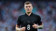 (FILES) Germany's midfielder Toni Kroos jogs during the UEFA EURO 2020 round of 16 football match between England and Germany at Wembley Stadium in London on June 29, 2021. World Cup winner Toni Kroos announced his return to the German national team on February 22, 2024 ahead of Euro 2024 on home soil. Kroos, 34, will be eligible for selection in the upcoming March international friendlies against France and the Netherlands. (Photo by JUSTIN TALLIS / POOL / AFP)