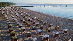 04 July 2022, Schleswig-Holstein, Timmendorfer Strand: Beach chairs stand in neat rows on a stretch of beach at Timmendorfer Strand (shot with a drone). The summer vacations have begun in Schleswig-Holstein and Mecklenburg-Western Pomerania. Photo: Christian Charisius/dpa (Photo by Christian Charisius/picture alliance via Getty Images)