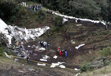 Rescue crew work at the wreckage of a plane that crashed into the Colombian jungle with Brazilian soccer team Chapecoense near Medellin, Colombia.
