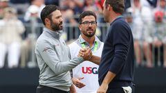 Adam Hadwin and Scottie Scheffler shake hands on the 18th green during the final round of the 122nd U.S. Open Championship at The Country Club on June 19, 2022 in Brookline, Massachusetts.