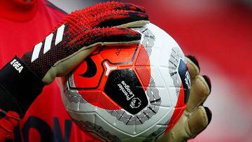 FILE PHOTO: Soccer Football - Premier League - Manchester United v Watford - Old Trafford, Manchester, Britain - February 23, 2020  General view of a match ball held by Manchester United&#039;s David de Gea during the warm up before the match   Action Ima