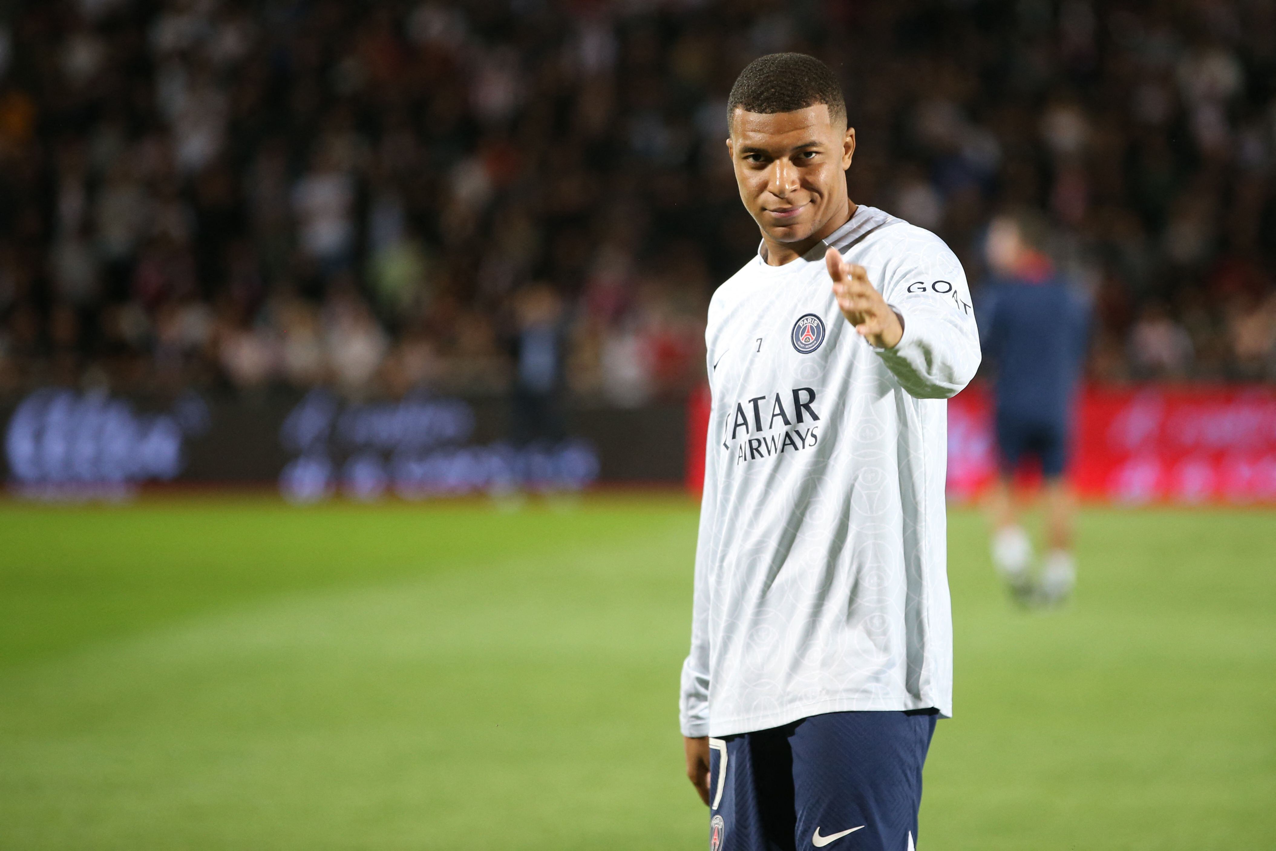 Paris Saint-Germain's French forward Kylian Mbappe gestures prior to the French L1 football match between AC Ajaccio and Paris Saint-Germain (PSG) at the Francois Coty Stadium in Ajaccio, Corsica, on October 21, 2022. (Photo by Pascal POCHARD-CASABIANCA / AFP)