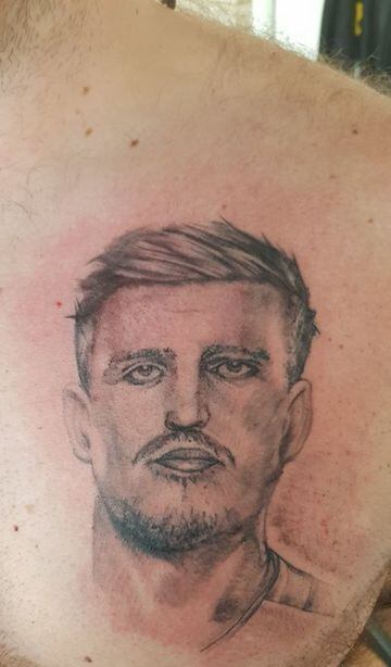 The face of Harry Maguire tattoed on the chest of an English fan. Maguire scored a header against Sweden that helped England book their place in the semi-final.