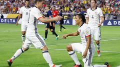  Carlos Bacca #7 of Colombia celebrates with James Rodriguez #10 after Bacca scored a first half goal against the United States 