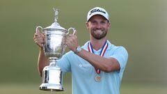 Wyndham Clark of the United States poses with the trophy after securing victory in the final round of the 123rd U.S. Open Championship