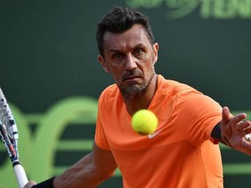 AC Milan&#039;s former player Paolo Maldini returns the ball during the men&#039;s doubles tennis match, with his partner Stefano Landonio against Poland&#039;s player Tomasz Bednarek and Nederland&#039;s player David Pel during the ATP Challenger Tour on