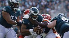 PHILADELPHIA, PENNSYLVANIA - OCTOBER 03: Jalen Hurts #1 of the Philadelphia Eagles is tackled by Derrick Nnadi #91 and Michael Danna #51 of the Kansas City Chiefs during the fourth quarter at Lincoln Financial Field on October 03, 2021 in Philadelphia, Pennsylvania.   Tim Nwachukwu/Getty Images/AFP == FOR NEWSPAPERS, INTERNET, TELCOS &amp; TELEVISION USE ONLY ==
