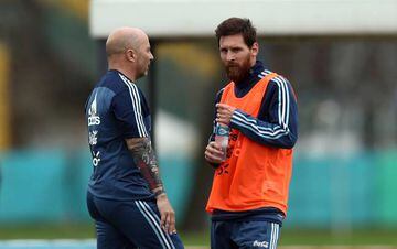 Argentina's head coach Jorge Sampaoli talks to Lionel Messi during a training session ahead of international friendly.