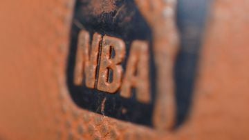 (FILES) In this file photo a detail view of the Spalding ball with NBA logo is seen during the game between the Orlando Magic and the Denver Nuggets on January 9, 2013 at the Pepsi Center in Denver, Colorado. - Two more NBA games were postponed by the lea