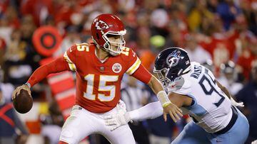 KANSAS CITY, MISSOURI - NOVEMBER 06: Patrick Mahomes #15 of the Kansas City Chiefs is pressured by DeMarcus Walker #95 of the Tennessee Titans in the first half at Arrowhead Stadium on November 06, 2022 in Kansas City, Missouri.   David Eulitt/Getty Images/AFP