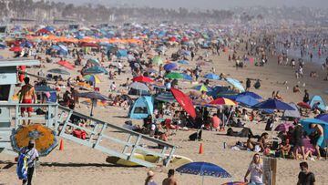 People gather on the beach at the Pacific Ocean on the first day of the Labor Day weekend amid a heatwave on September 5, 2020 in Santa Monica, California.