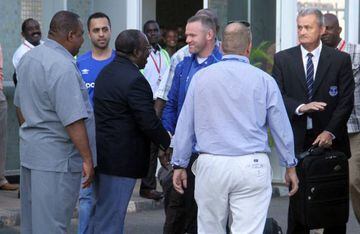 Wayne Rooney meets Tanzanian sports officials at Julius Nyerere International Airport.
