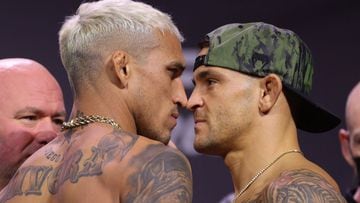 LAS VEGAS, NEVADA - DECEMBER 10: Charles Oliveira of Brazil and Dustin Poirier face off during the UFC 269 ceremonial weigh-in at MGM Grand Garden Arena on December 10, 2021 in Las Vegas, Nevada.   Carmen Mandato/Getty Images/AFP == FOR NEWSPAPERS, INTER