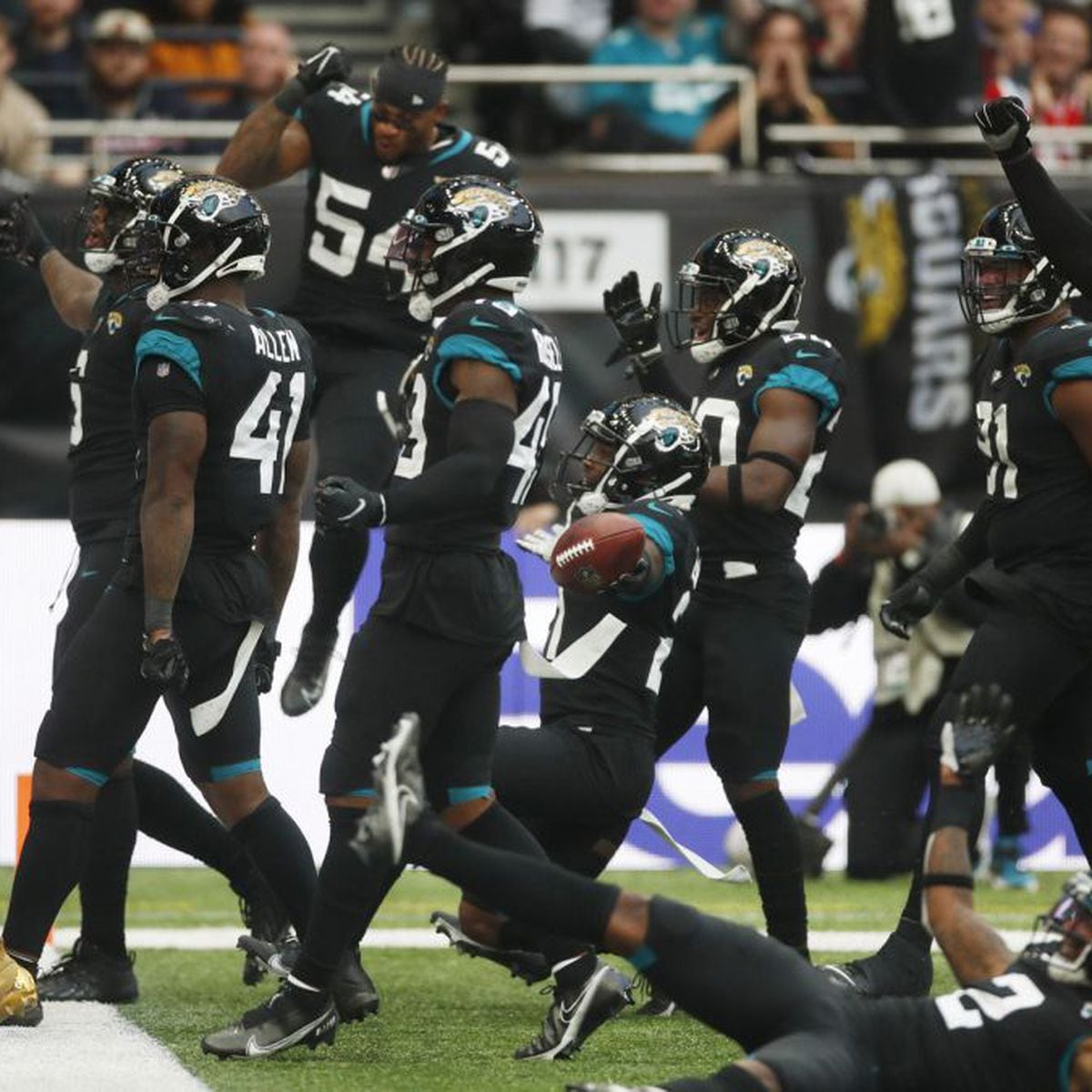 Jacksonville, FL, USA. 19th Sep, 2021. Jacksonville Jaguars wide receiver  Marvin Jones Jr. (11) celebrates with Jacksonville Jaguars quarterback  Trevor Lawrence (16) after a touch down during 1st half NFL football game